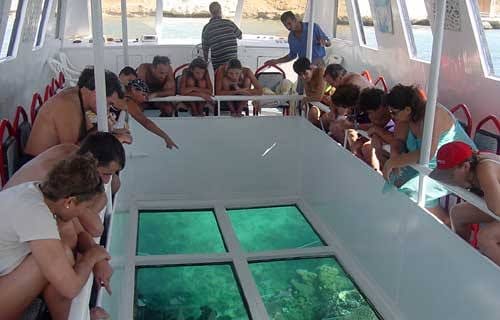 Glass-bottom tamaran boat for viewing coral reefs